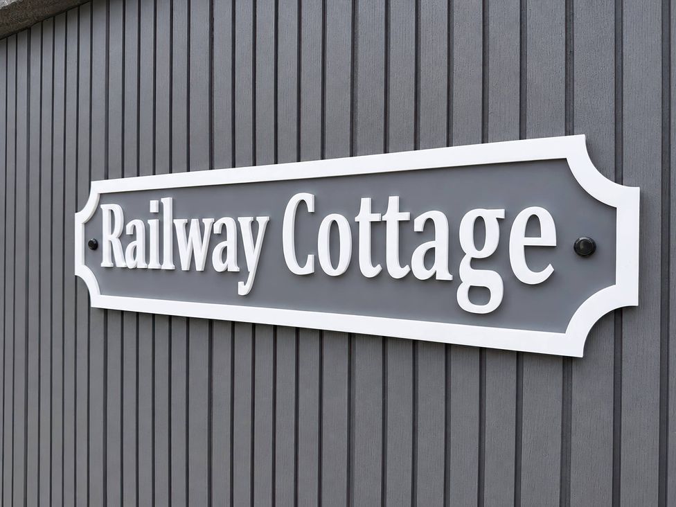A sign displaying Railway Cottage at Railway Cottage in Penybontfawr