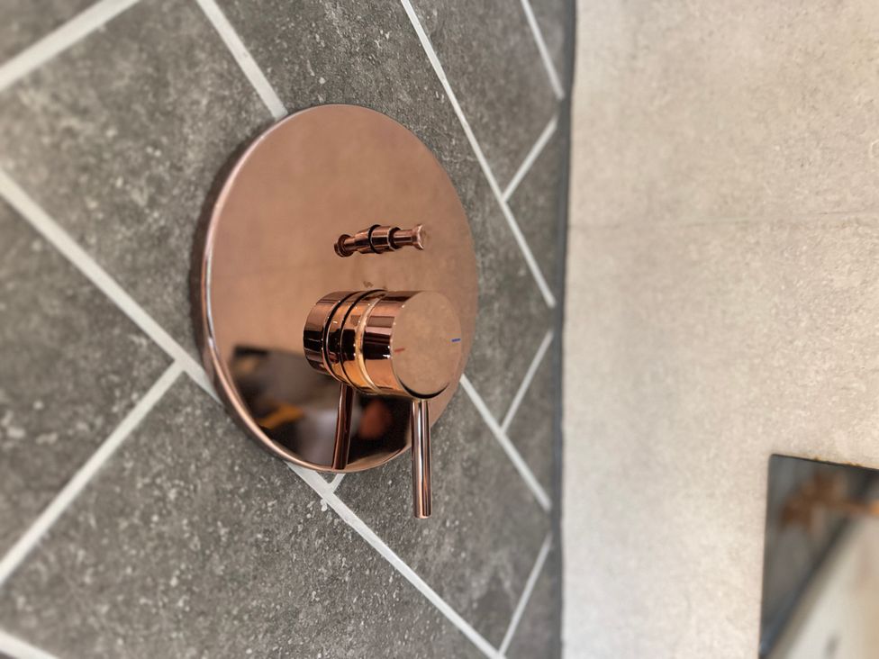 A faucet mounted on the wall at Railway Cottage in Penybontfawr