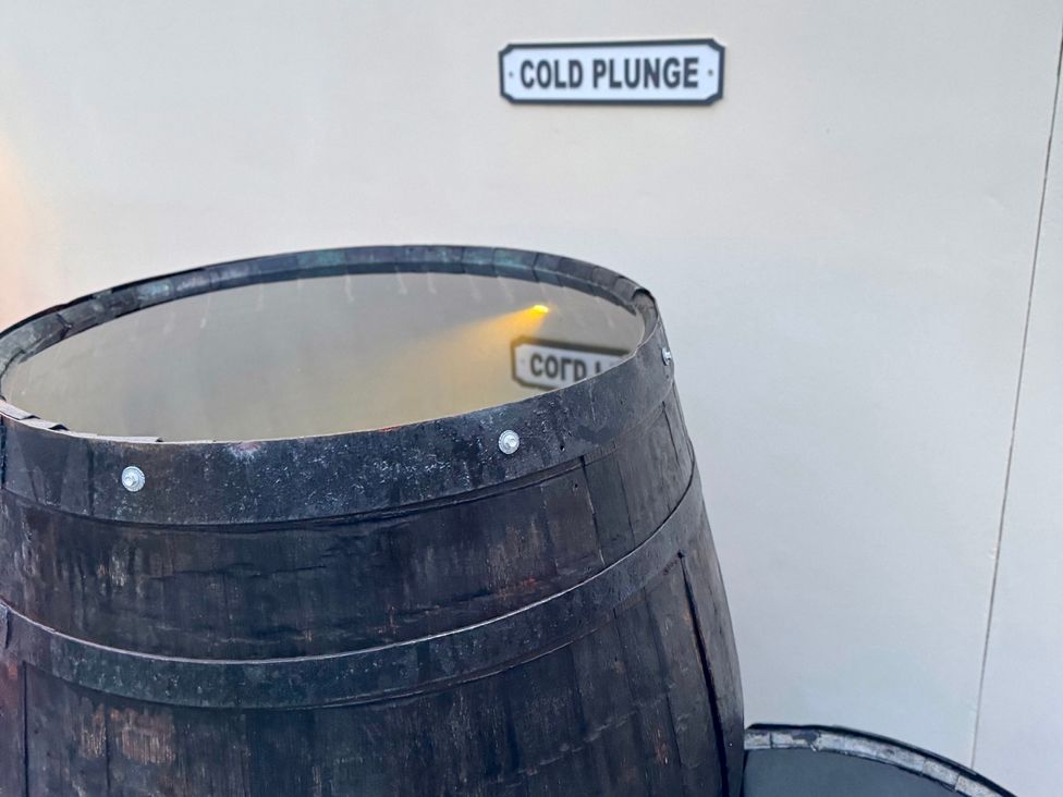 A cold plunge barrel at Railway Cottage in Penybontfawr
