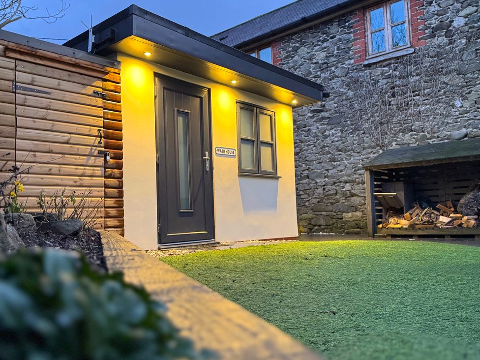 An entrance with a sign at Railway Cottage in Penybontfawr