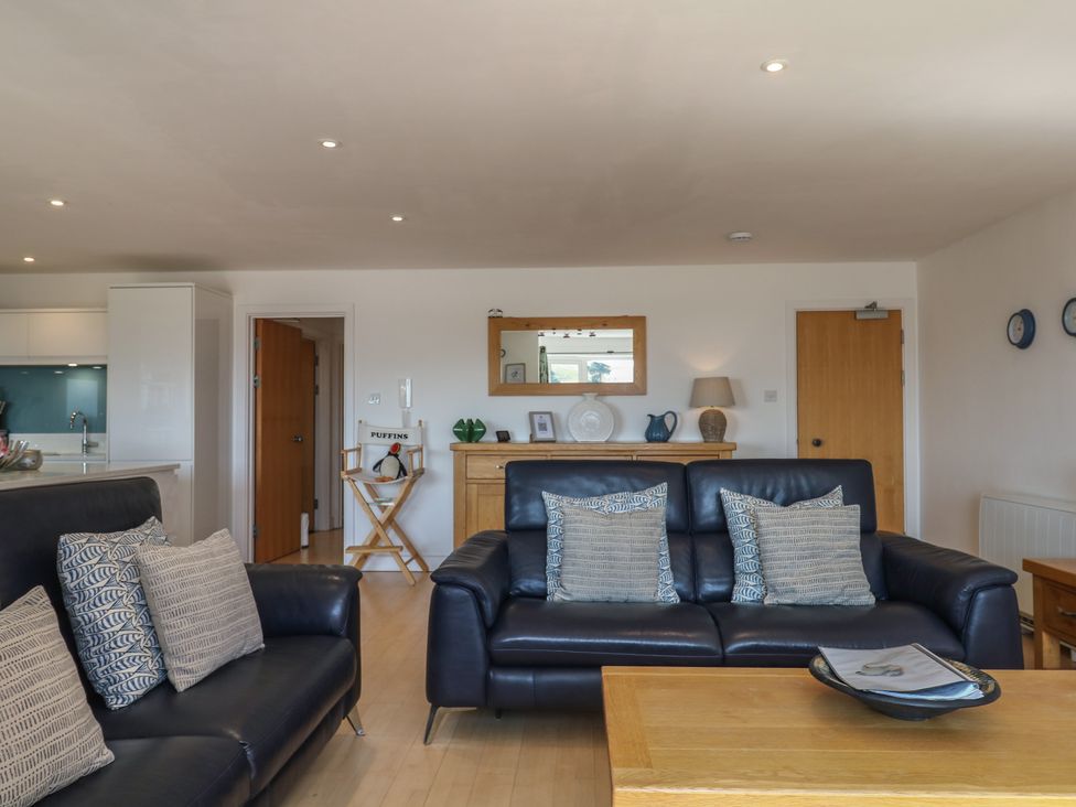 A living room with a sofa and coffee table at 4 Burgh Island Causeway in Bigbury