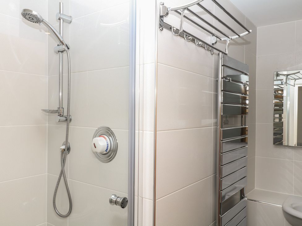A bathroom with a shower and towel warmer at 4 Burgh Island Causeway in Bigbury