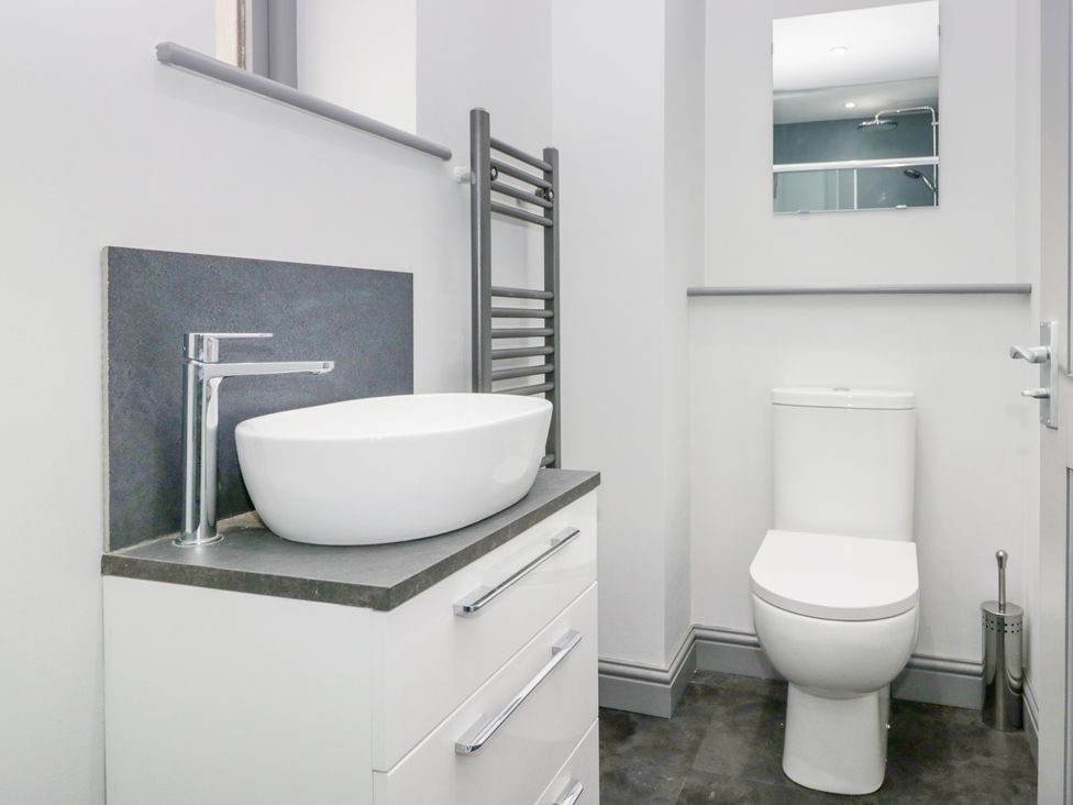 A bathroom with a sink and toilet at Fell View Cottage in Lambrigg near Kendal