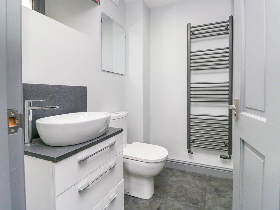 A bathroom with a sink and toilet at Fell View Cottage in Lambrigg near Kendal