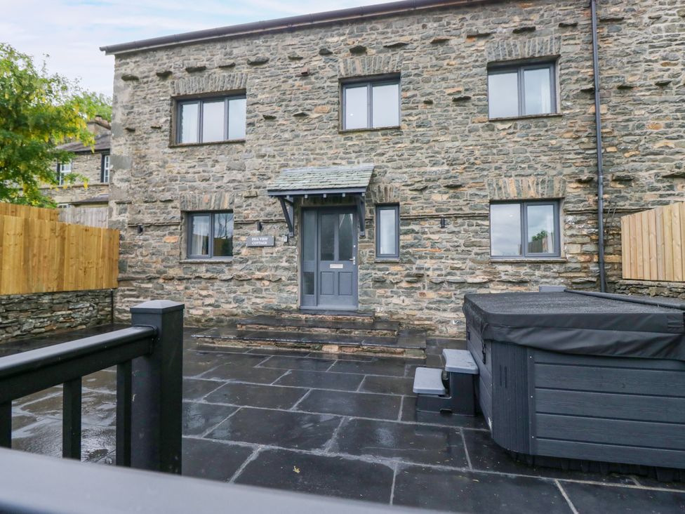 An outdoor area with a hot tub at Fell View Cottage in Lambrigg near Kendal