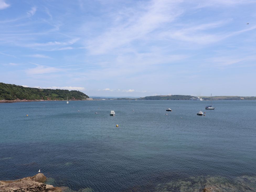 A view of water with boats and land in the background at Marina