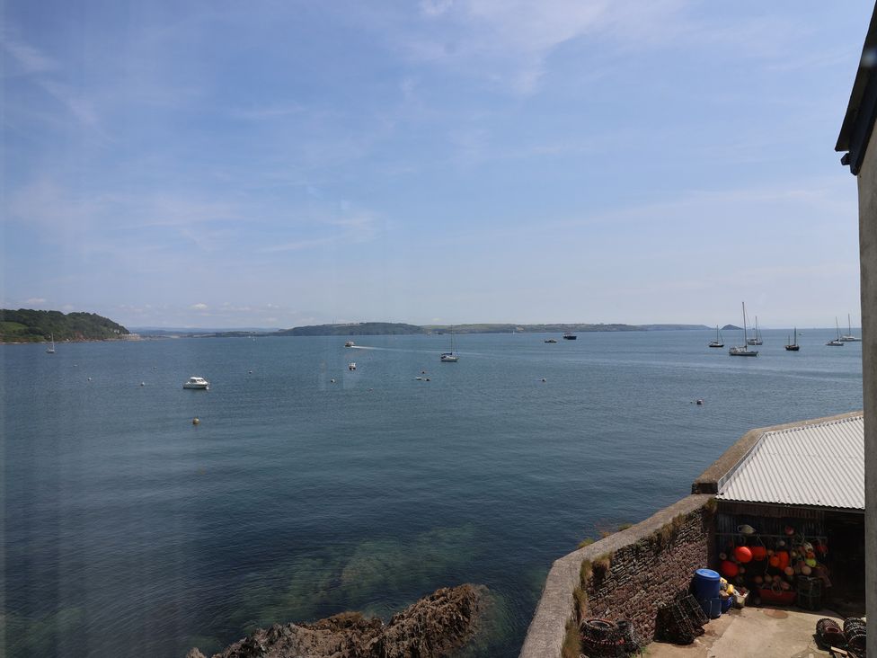 A view of the sea with boats and land at Marina 