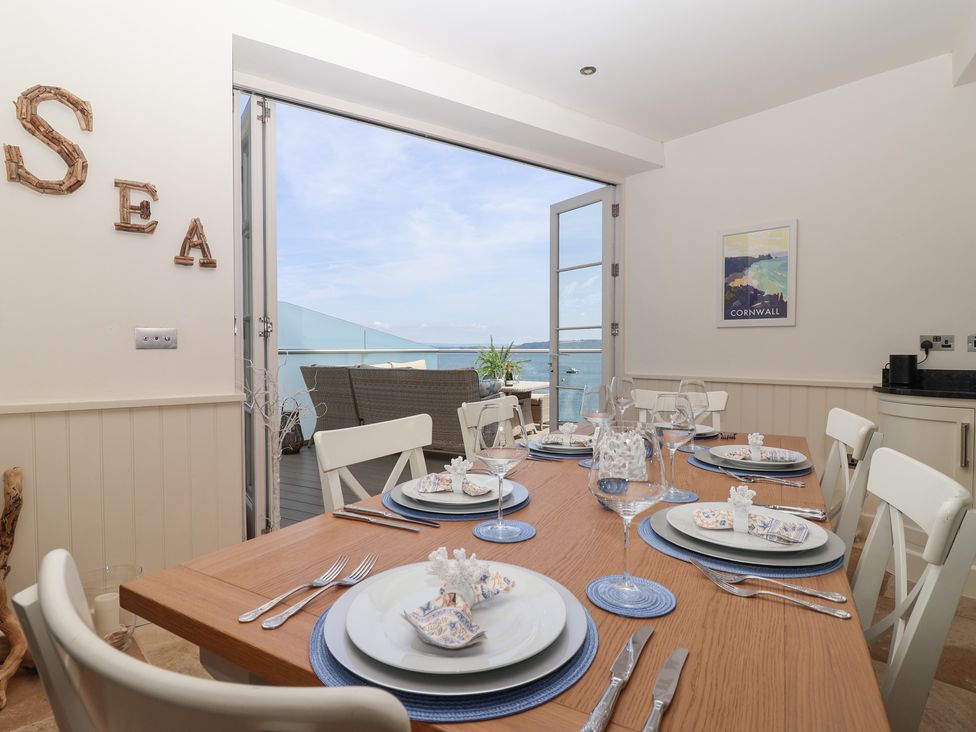A dining room with a table set for dinner at Marina