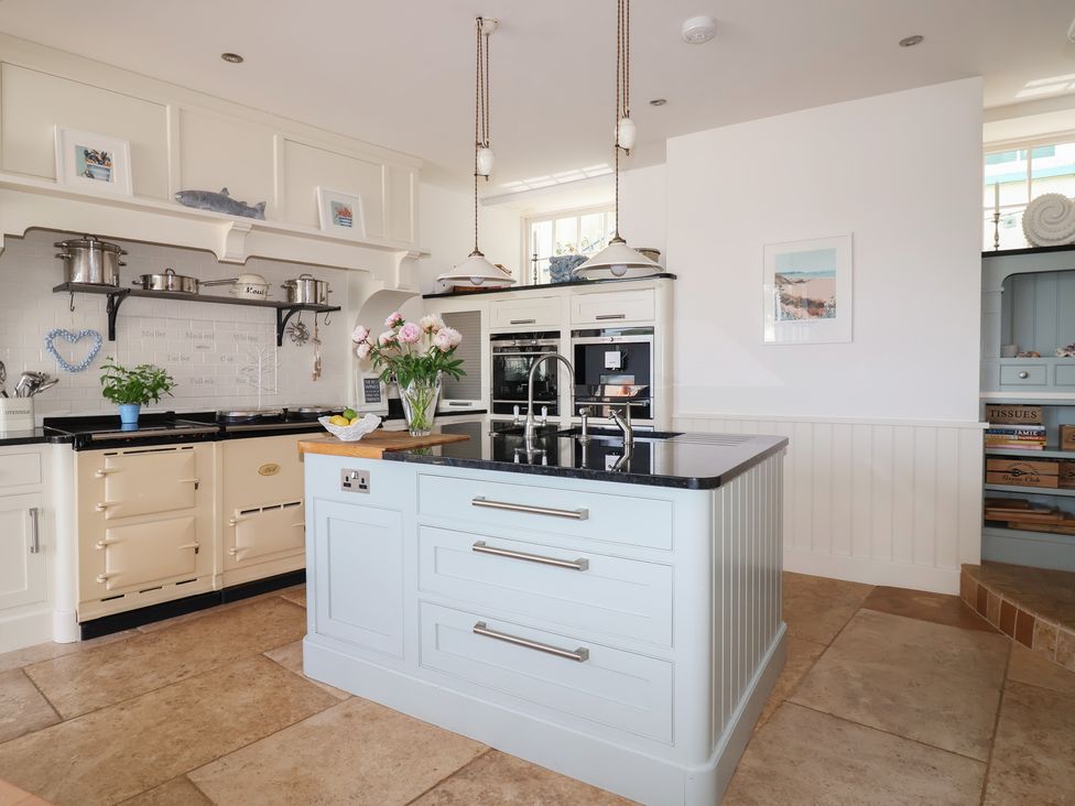 A kitchen with appliances and a central island at Marina