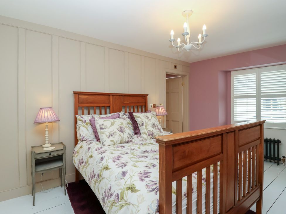 A bedroom with a bed and bedside table at Marina in 