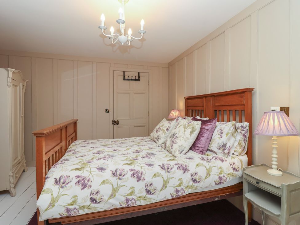 A bedroom with a bed and wardrobe at Marina