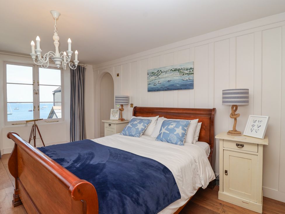A bedroom with a bed and window at Marina in 