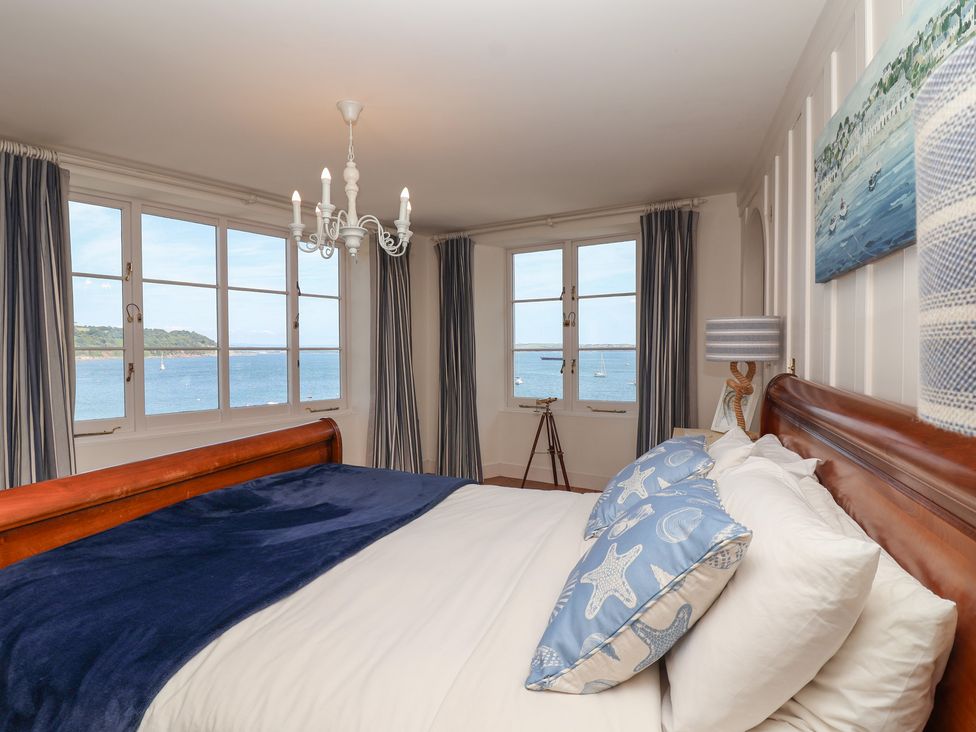 A bedroom with a bed and windows at Marina in 