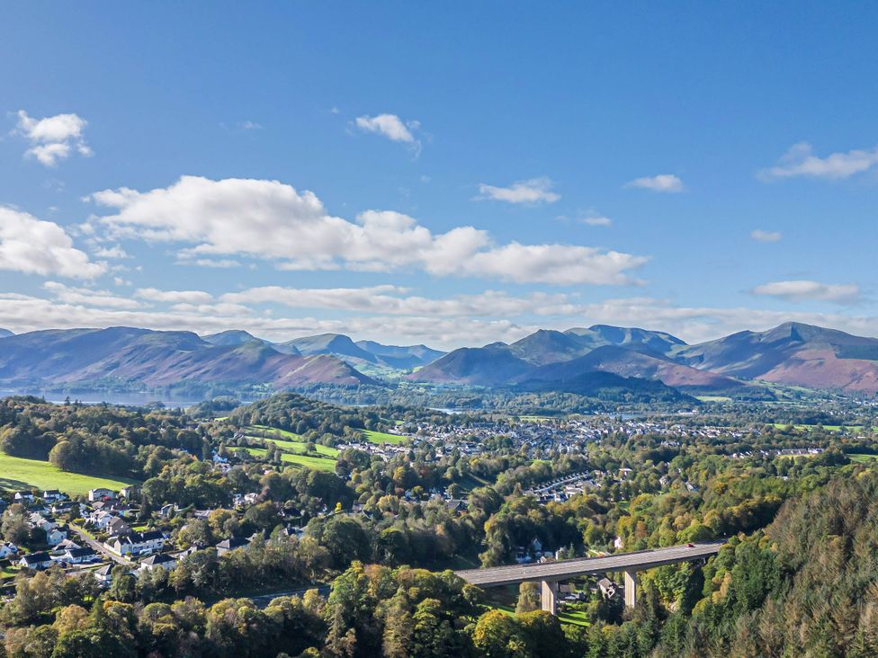 A view of mountains and a valley with a bridge at Apartment 1 in Keswick
