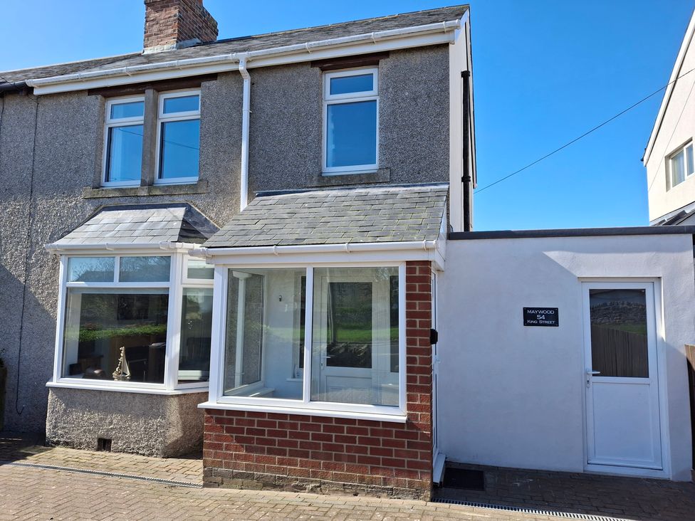 A house with windows and a door at Maywood in Seahouses