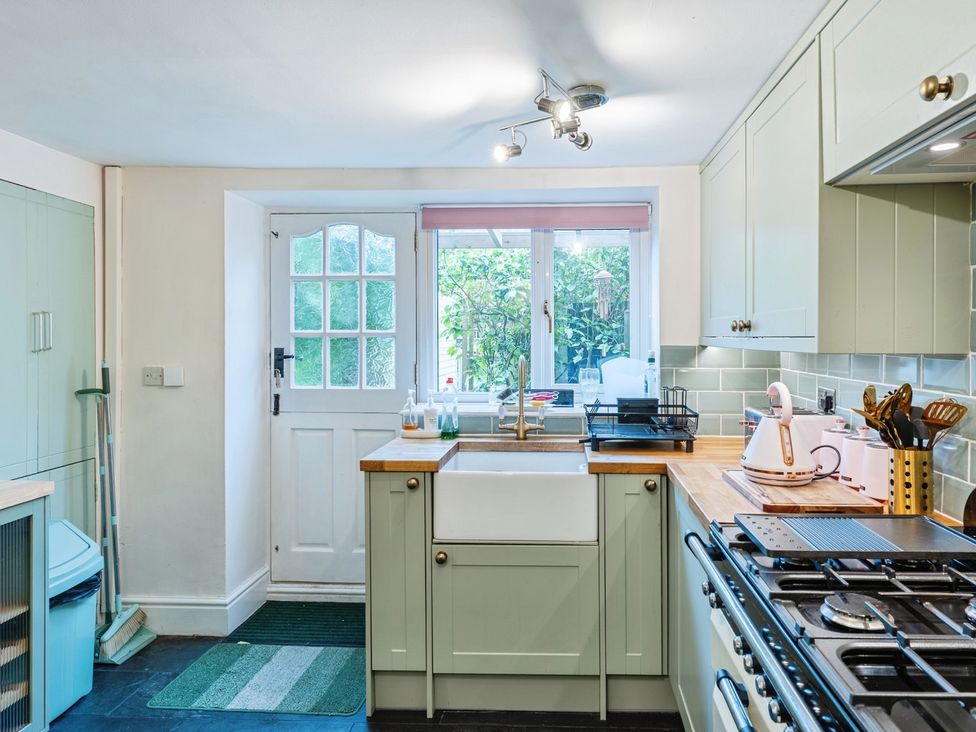 A kitchen with a sink and stove at Rivendell in Ffynnongroyw