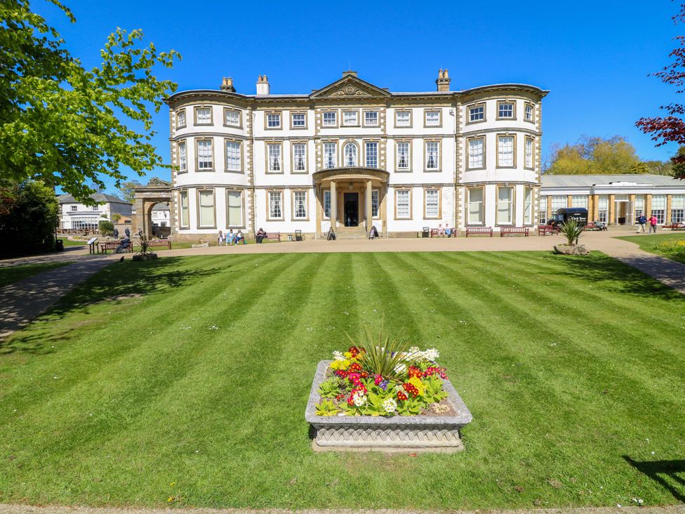 A building with a lawn and flower bed at Apt 6 @ Hunter's Quay Bridlington