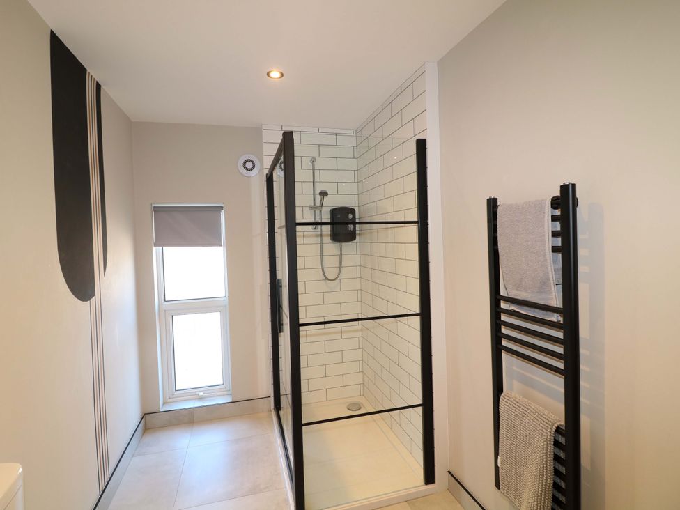 A bathroom with a shower and towel radiator at Apt 7 @ Hunter's Quay Bridlington