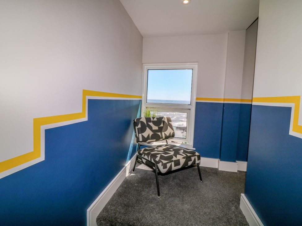 A nook with an armchair and a window at Apt 7 @ Hunter's Quay Bridlington