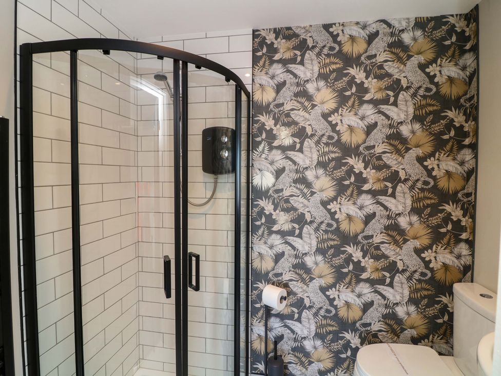 A bathroom with a shower enclosure and a toilet at Apt 8 @ Hunter's Quay, Bridlington