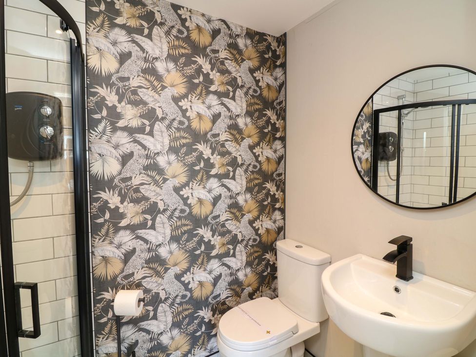 A bathroom featuring a shower, toilet, and sink at Apt 8 @ Hunter's Quay, Bridlington