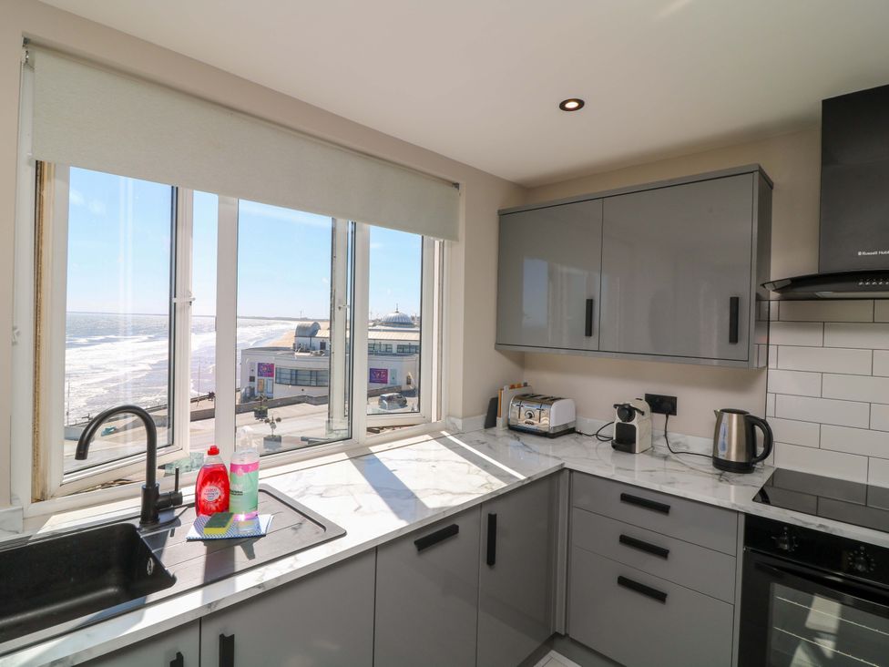 A kitchen with a sink and kitchen appliances at Apt 9 @ Hunter's Quay Bridlington