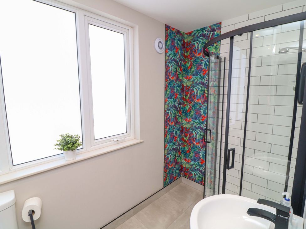 A bathroom with a shower and sink at Apt 9 @ Hunter's Quay Bridlington