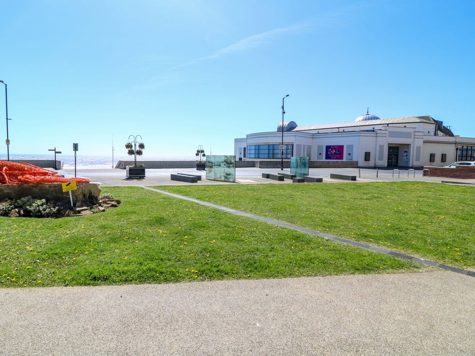 An outdoor area with grass and a building at Apt 10 @ Hunter's Quay in Bridlington