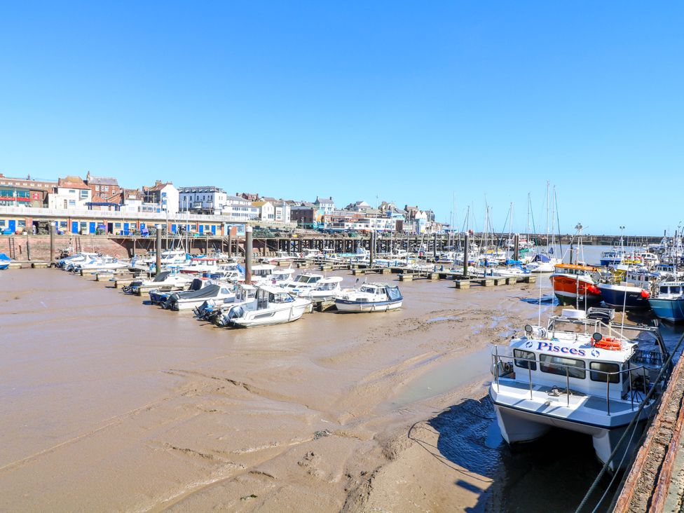 A harbor with boats and buildings at Apt 10 @ Hunter's Quay Bridlington