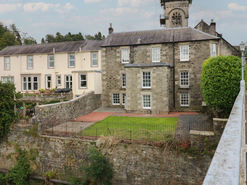 A house with a yard and fence at Eskvale House in Langholm