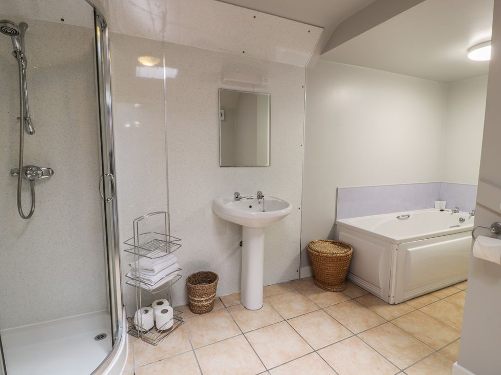 A bathroom with a sink and shower at King's Apartment