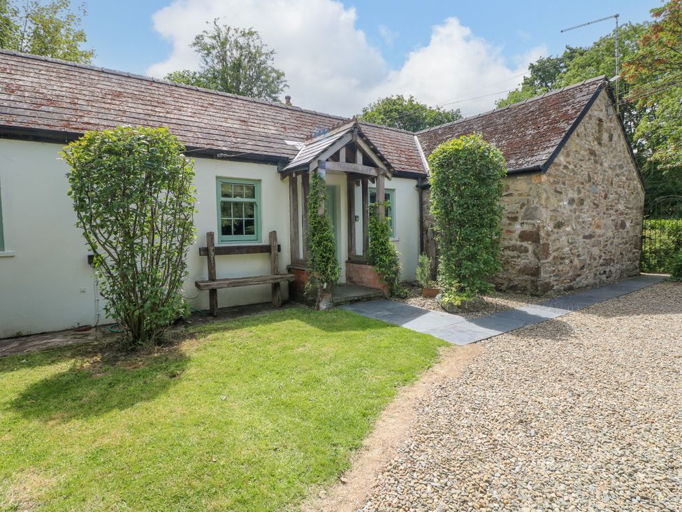A house with a stone wall and garden at Glas y Dorlan Nevern near Newport, Pembrokeshire