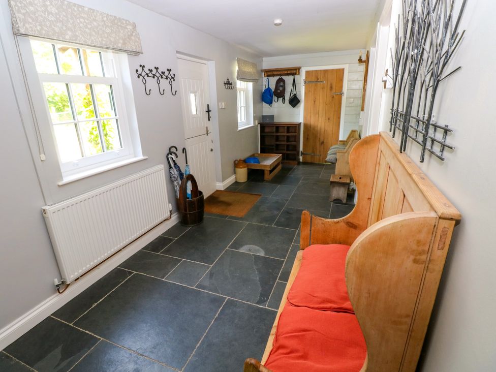 A hallway with a bench and coatrack at Glas y Dorlan Nevern near Newport, Pembrokeshire