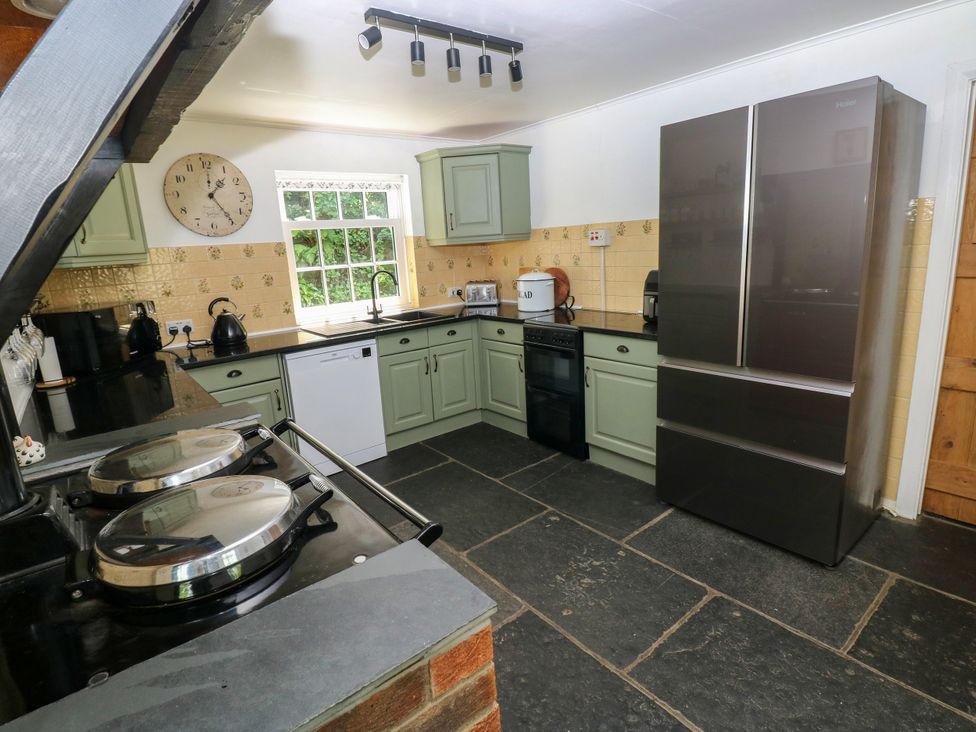 A kitchen with a refrigerator and oven at Glas y Dorlan Nevern near Newport, Pembrokeshire