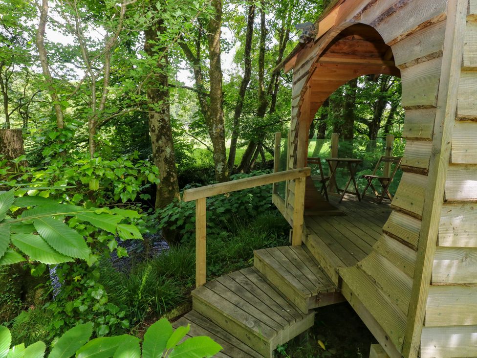 A wooden structure with a staircase and chairs at Glas y Dorlan, Nevern near Newport, Pembrokeshire