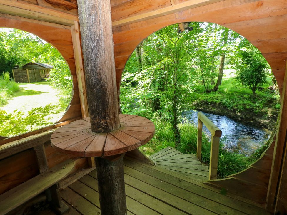 A view of a wooden structure near a stream at Glas y Dorlan Nevern near Newport, Pembrokeshire