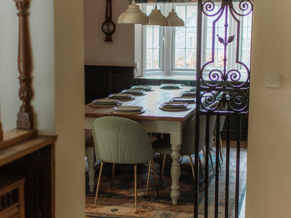 A dining room with a table set for dinner at Grey Walls in Glenridding