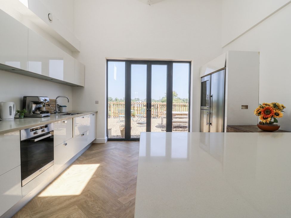 A kitchen with appliances and a view at Little Yeat Farm (4 Bed/4 Bath) Aylesbury