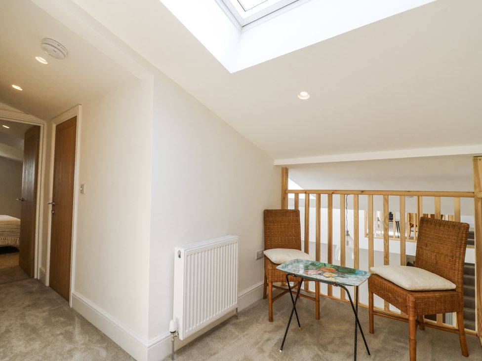 A landing area with chairs and a table at Little Yeat Farm (4 Bed/4 Bath) Aylesbury