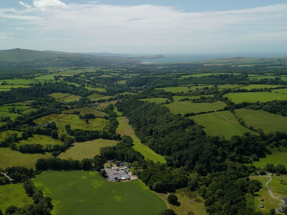An aerial view of fields and trees near the coast at Glanduad Fawr Newport, Pembrokeshire