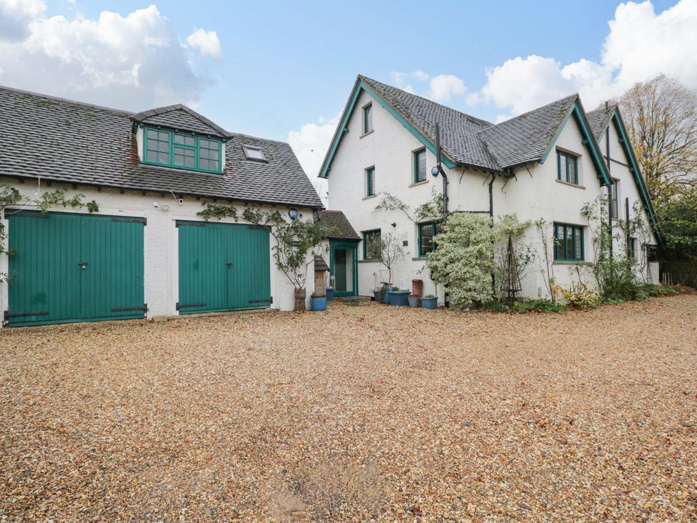 A house with a garage and gravel driveway at White House