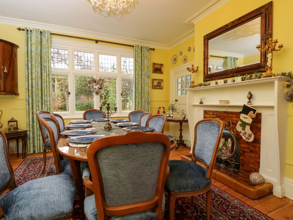 A dining room with a table and chairs at White House