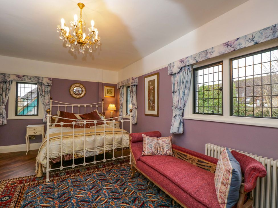 A bedroom with a bed and sofa at White House