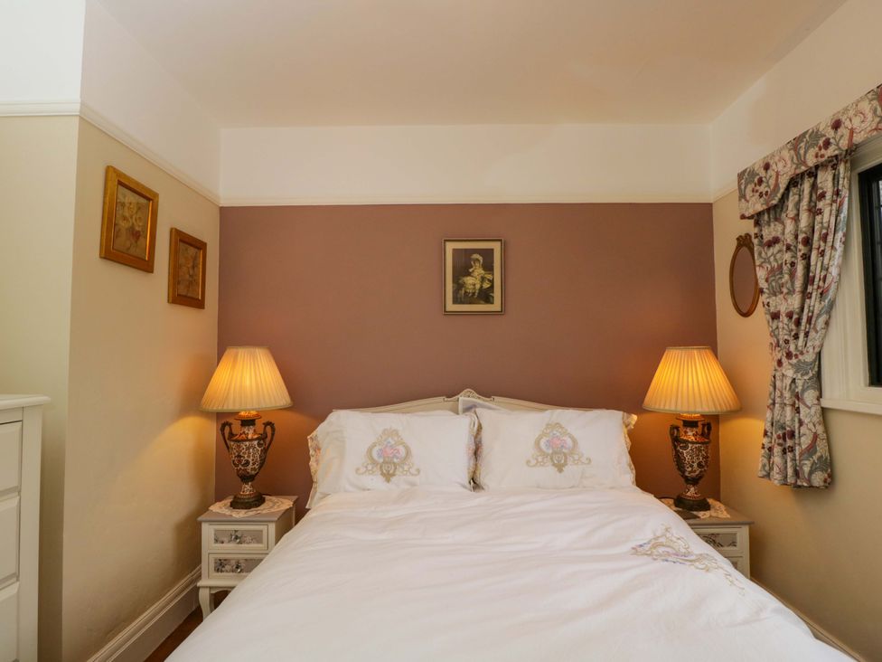 A bedroom with a bed and lamps at White House in 