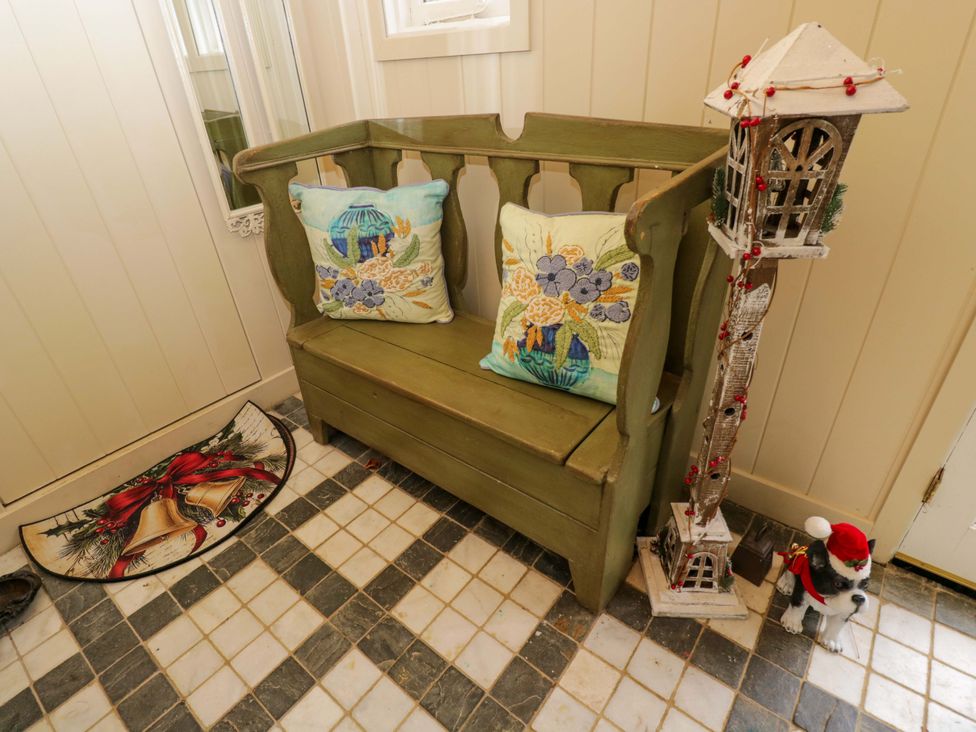 An entryway with a bench and decorative items at White House