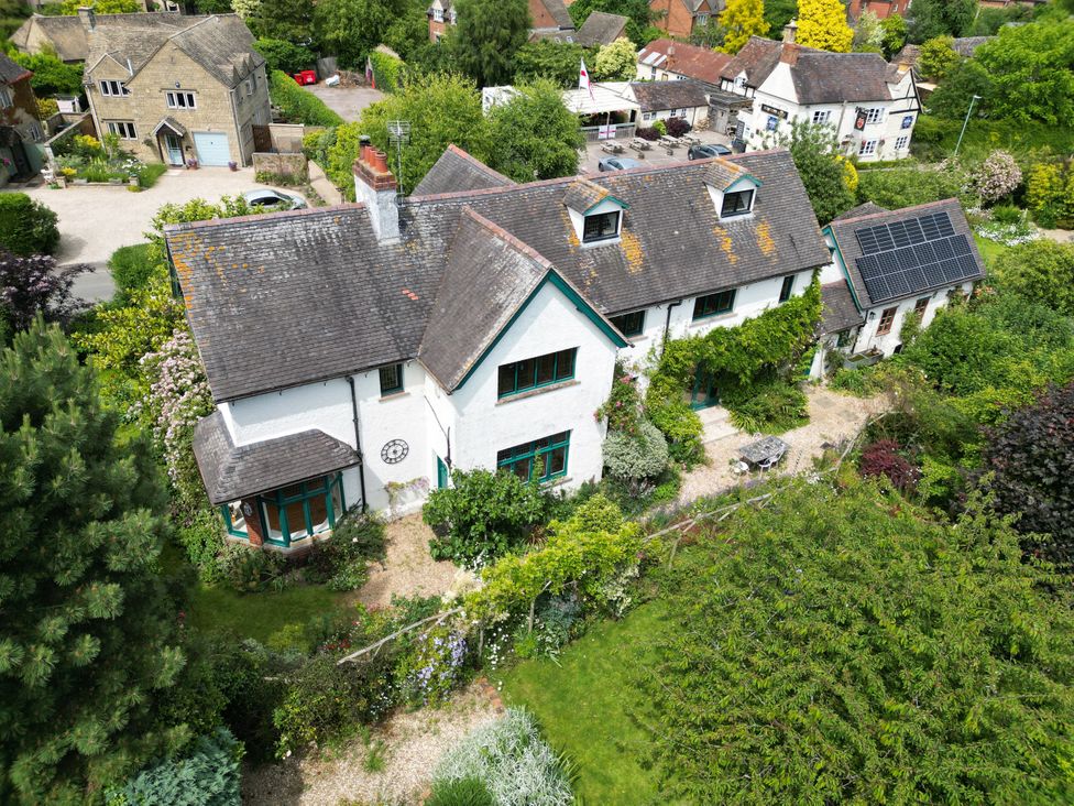 An aerial view of a house with garden and solar panels at White House