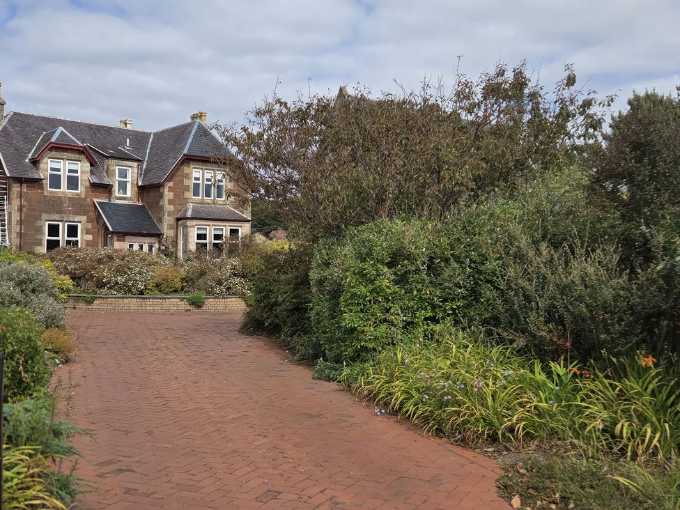 A house with a garden and pathway at The Old Rectory Largs