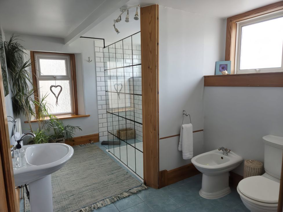 A bathroom with a sink, toilet, and shower at The Old Rectory in Largs