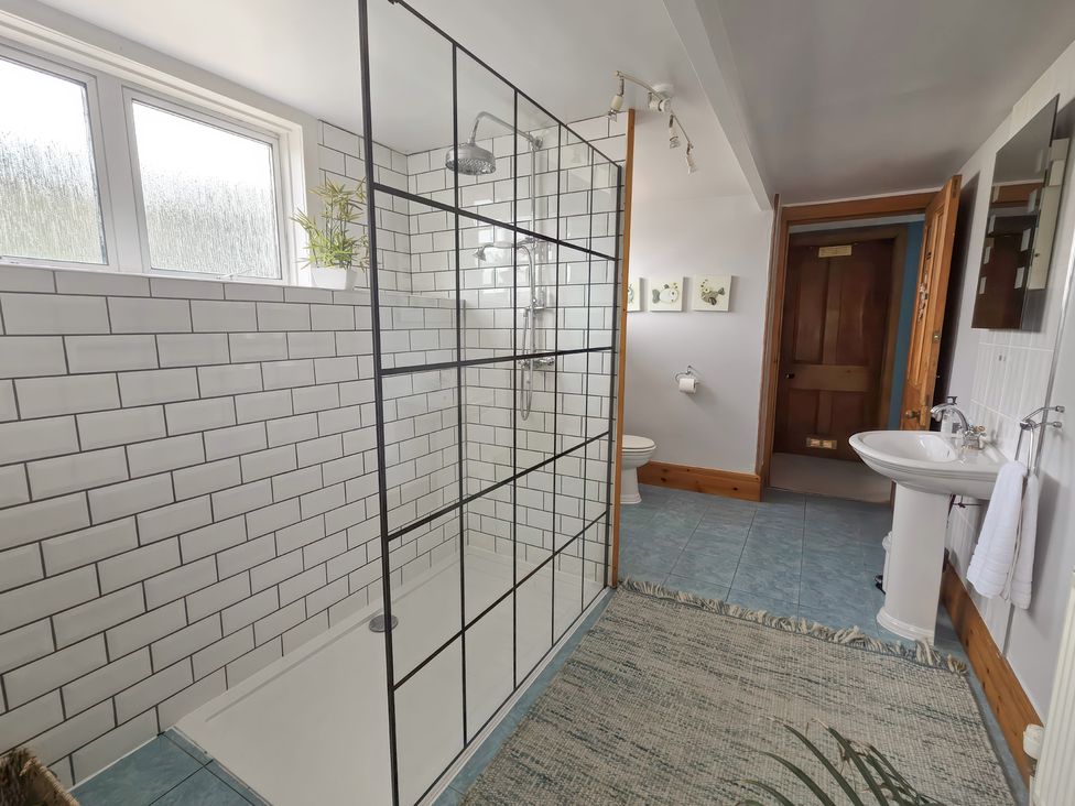 A bathroom with shower, toilet and sink at The Old Rectory in Largs