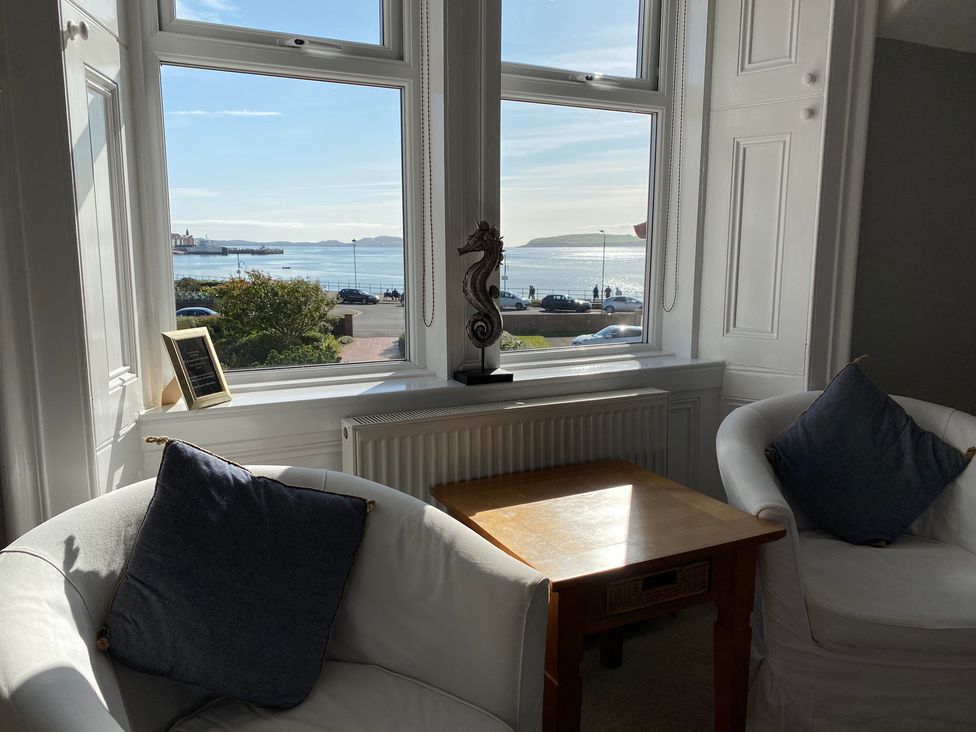 A living room with a view of the sea at The Old Rectory in Largs